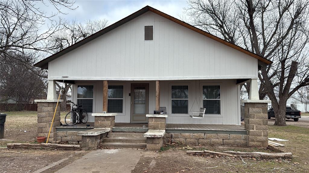 View of front of home featuring covered porch