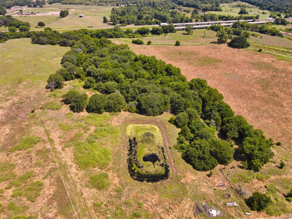Aerial view of property and surrounding area with rural landscape