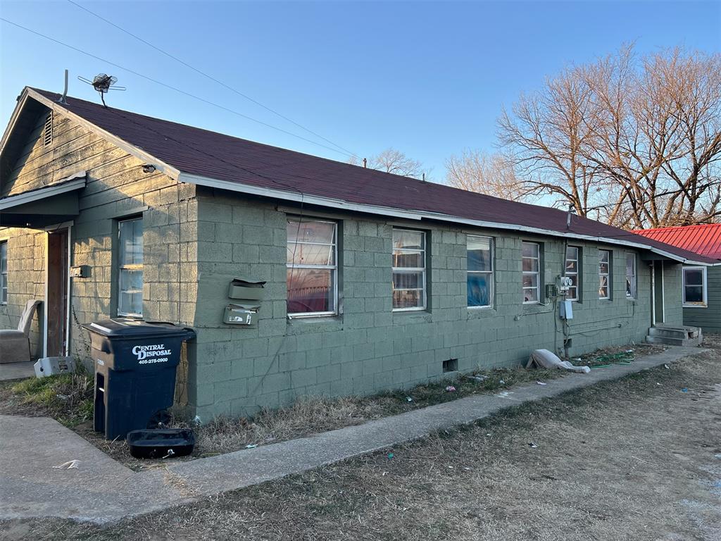 View of side of property with concrete block siding