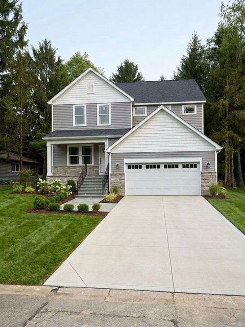 Photo of 1612 Whispering Pine Lane, Bellefontaine, OH 43311 (MLS # 226022042)