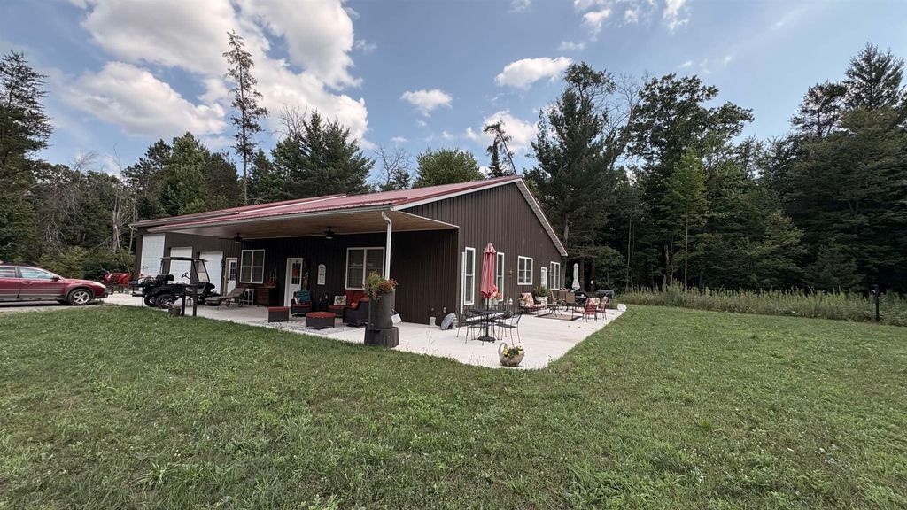 Photo of 810 E Arnold Lk Road, Harrison, MI 48625 (MLS # 50183425)