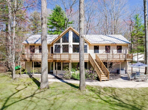 Photo of 125 Dubonnet Trail, Interlochen, MI 49643 (MLS # 80068118)