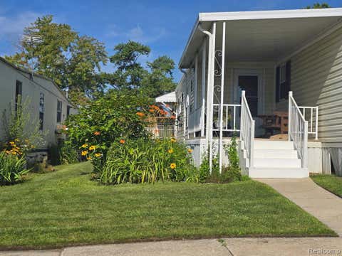 Photo of 211 Pinewood Dr, White Lake, MI 48386 (MLS # 61015149)