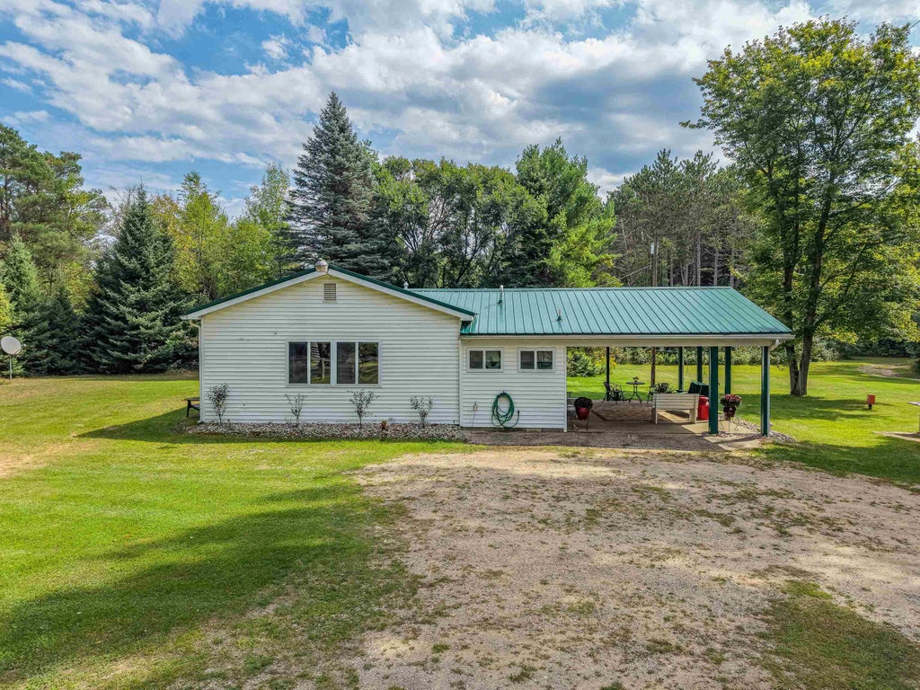 Photo of 395 W M61 Highway, Gladwin, MI 48624 (MLS # 50220480)