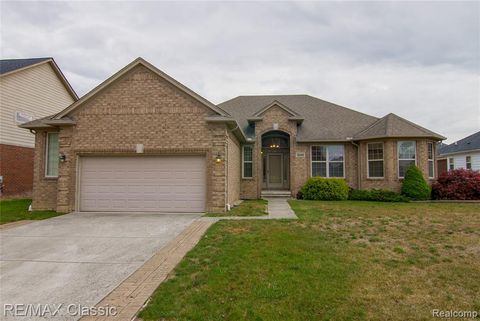 Photo of 50416 Pinnacle Woods Lane, Macomb, MI 48042 (MLS # 60946138)