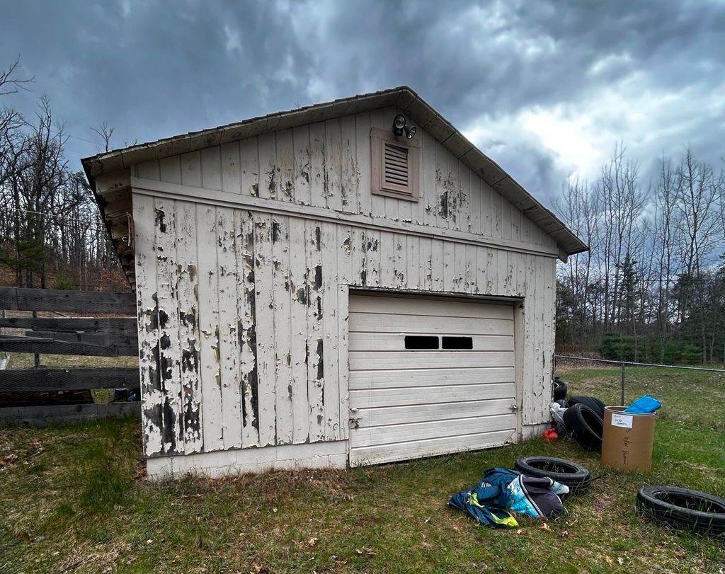 Photo of 601 Eola Road, Harrison, MI 48625 (MLS # 50205941)