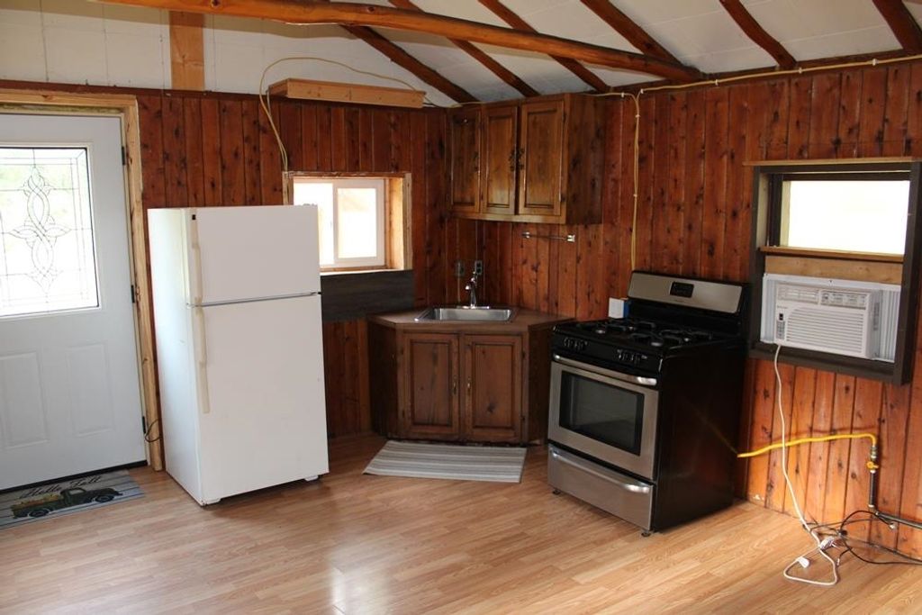 Photo of 301 ROBERT Street, Harrison, MI 48625 (MLS # 50185411)