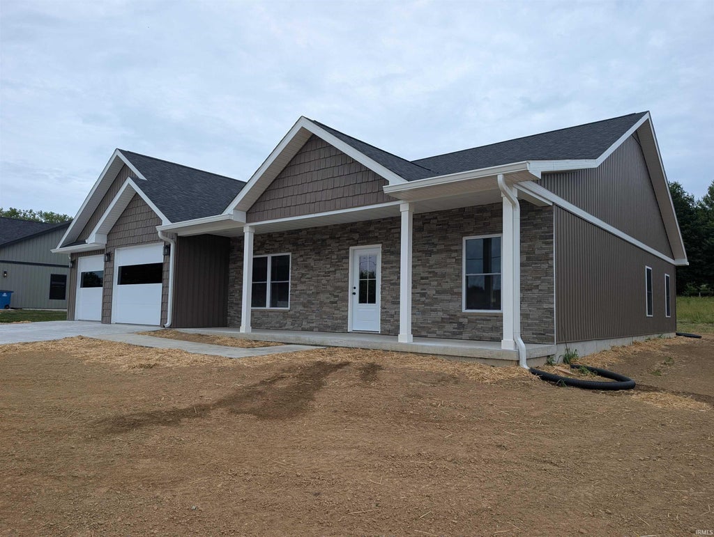 Photo of 217 Poplar Street, Loogootee, IN 47553 (MLS # 202622452)