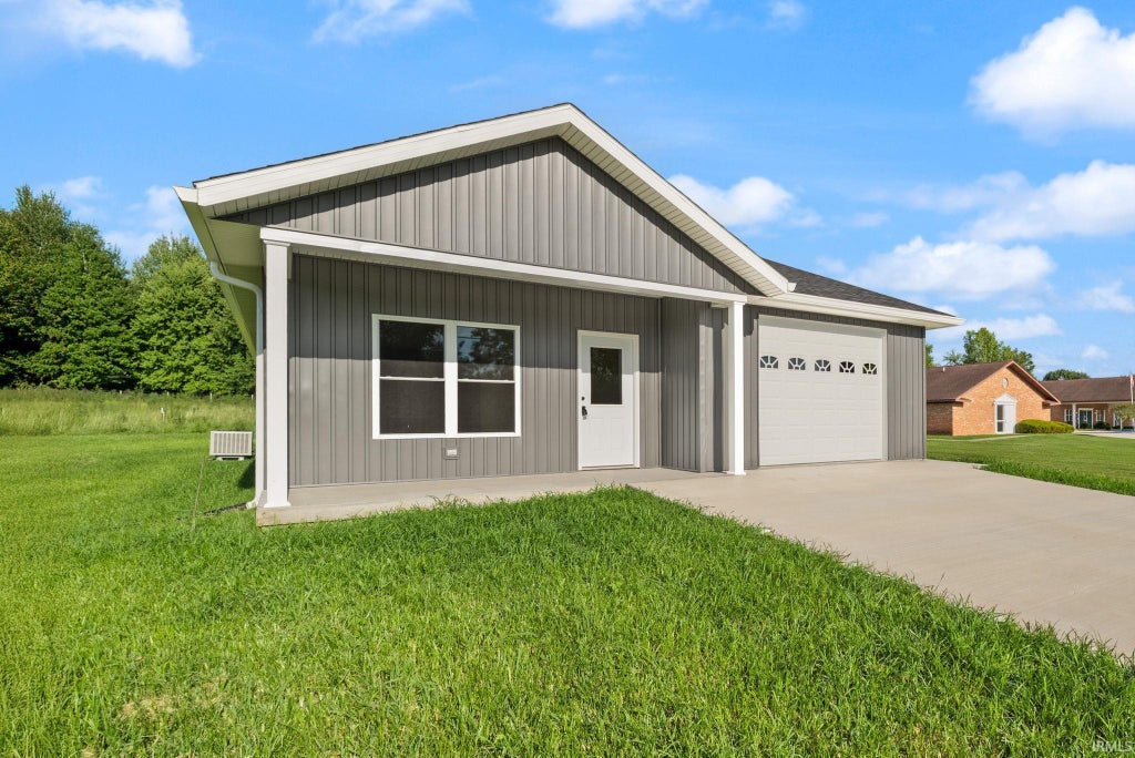 Photo of 219 Poplar Street, Loogootee, IN 47553 (MLS # 202628372)
