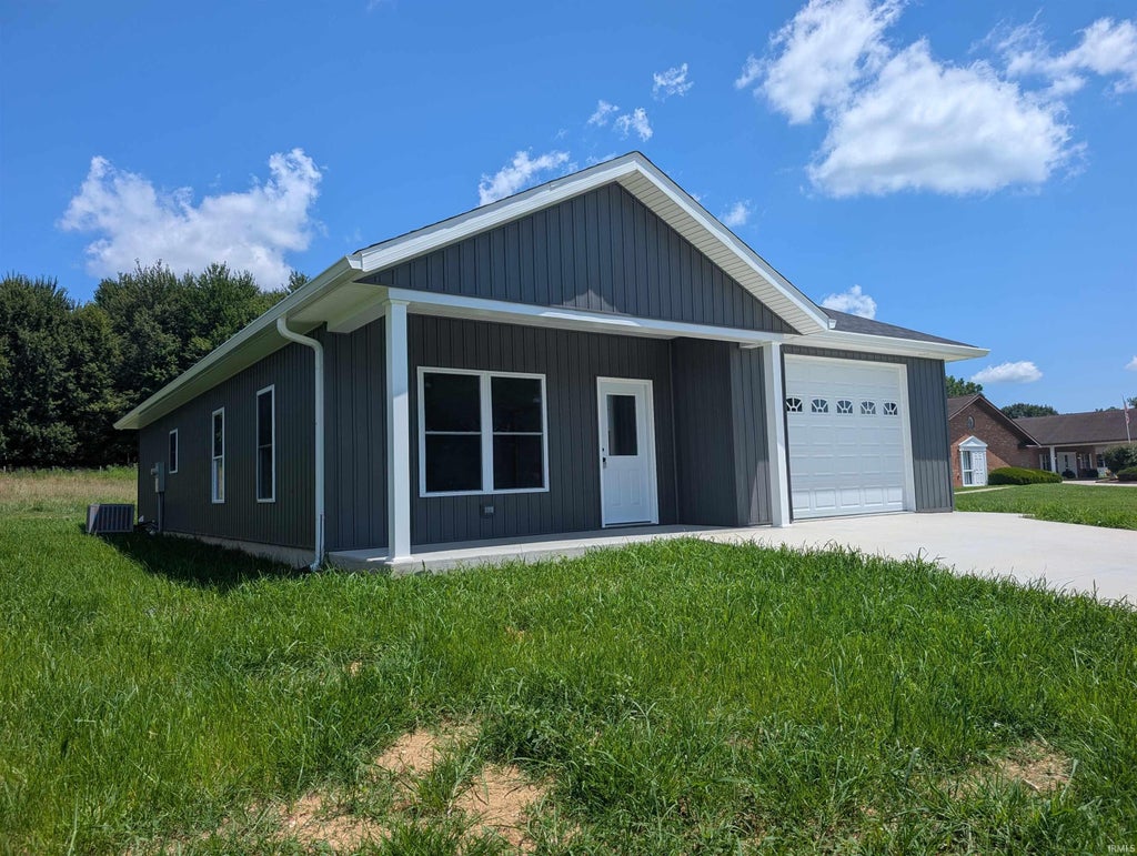 Photo of 219 Poplar Street, Loogootee, IN 47553 (MLS # 202628372)