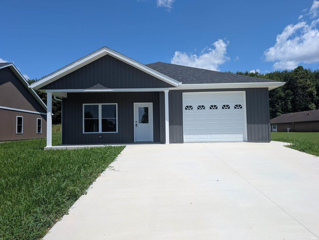 Photo of 219 Poplar Street, Loogootee, IN 47553 (MLS # 202628372)