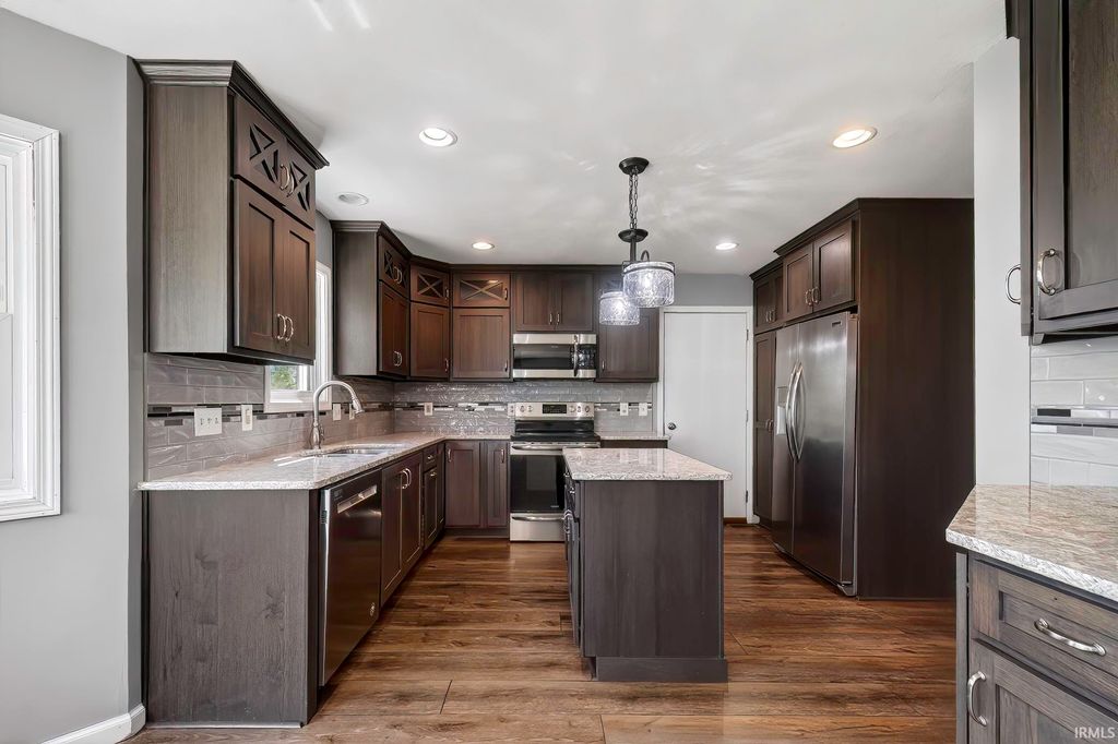 Photo of 1003 Woodcreek Drive, Ossian, IN 46777 (MLS # 202617543)