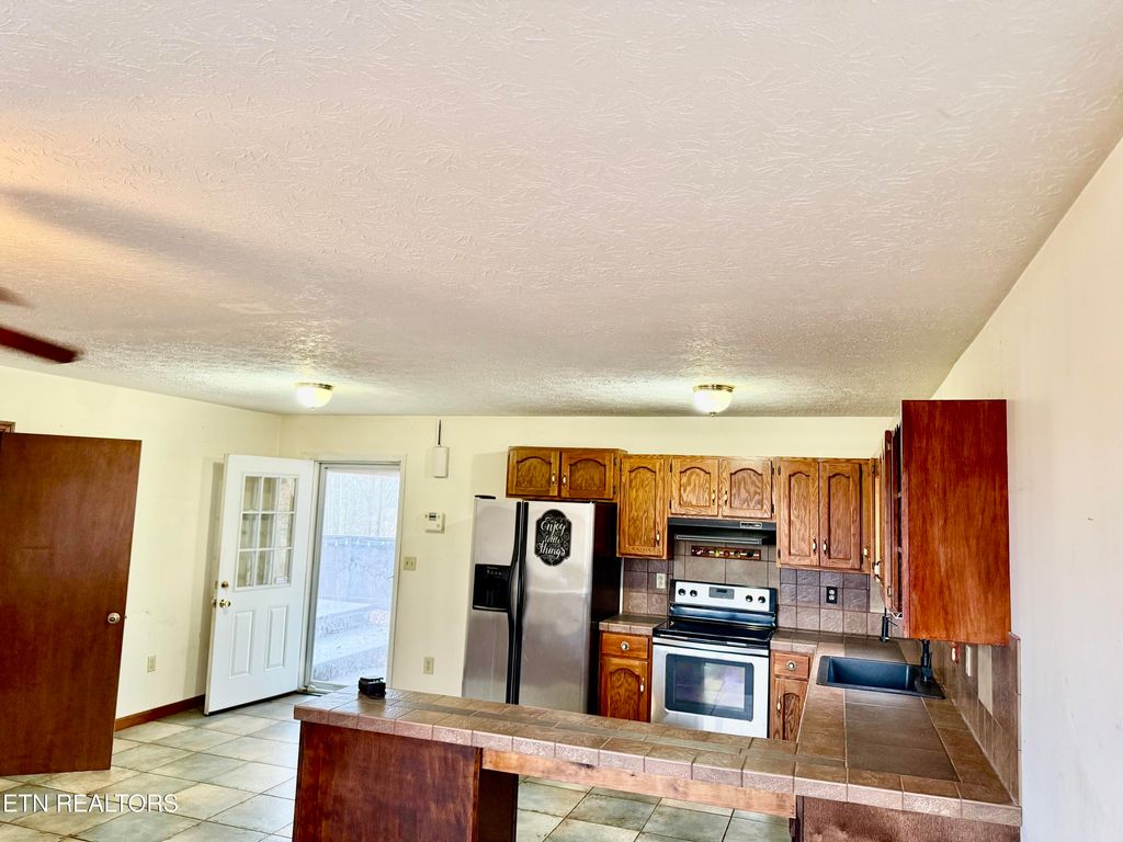 Photo of 450 FOREST HILLS Drive, New Tazewell, TN 37825 (MLS # 1286453)