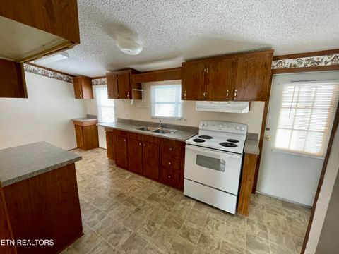 Tiny photo for 713 E Kentucky Ave, LaFollette, TN 37766 (MLS # 1328286)