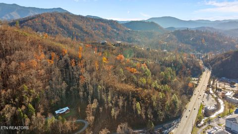 Photo of 830 Sleepy Hollow Rd, Gatlinburg, TN 37738 (MLS # 1310836) Photo of 830 Sleepy Hollow Rd, Gatlinburg, TN 37738 (MLS # 1310836)