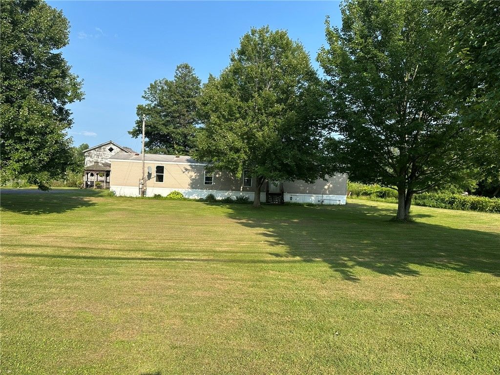Photo of 5676 State Route 14, Sodus, NY 14551 (MLS # R1701110)
