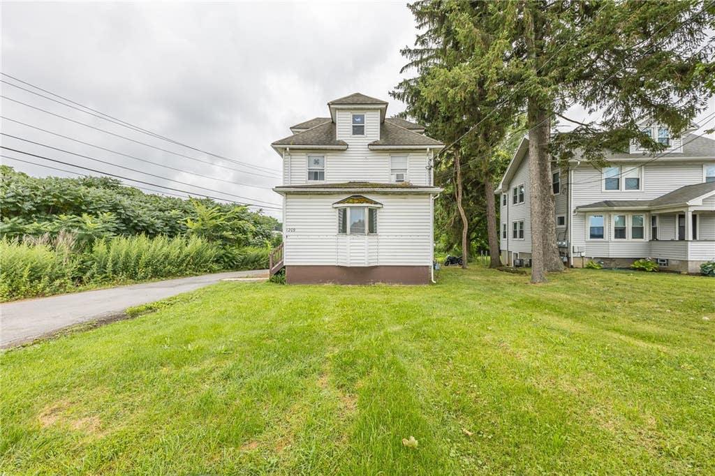 Photo of 1209 Ridge Road, Webster, NY 14580 (MLS # R1702408)