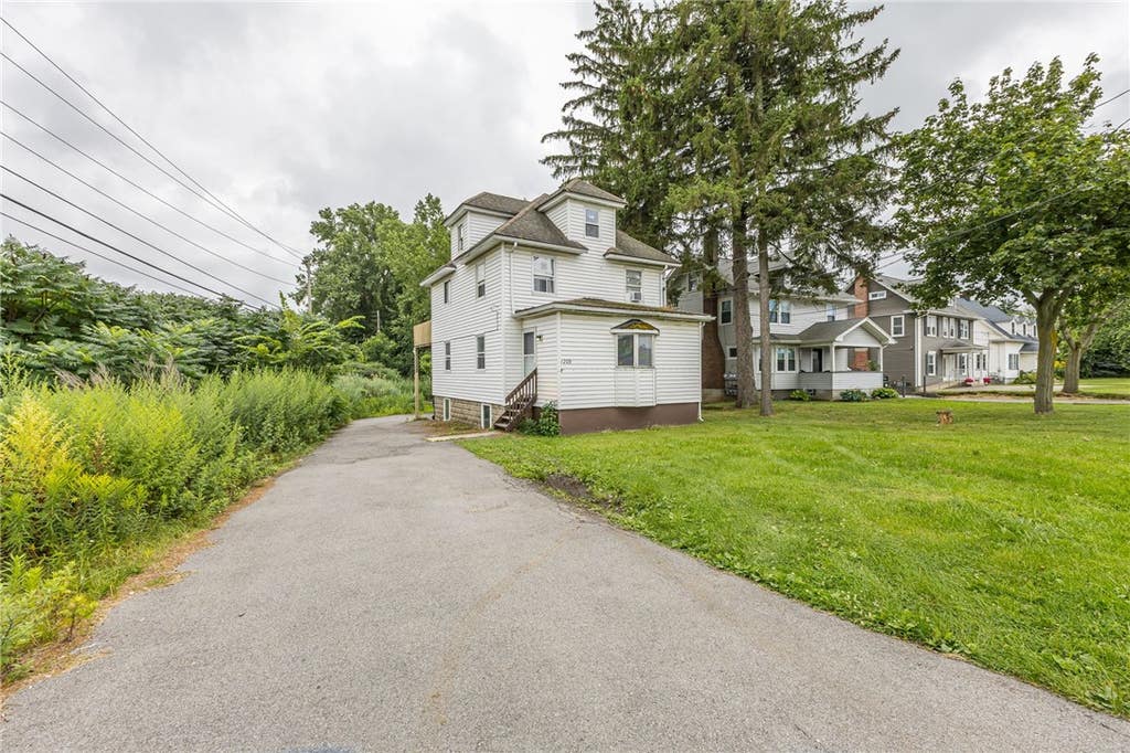 Photo of 1209 Ridge Road, Webster, NY 14580 (MLS # R1702408)