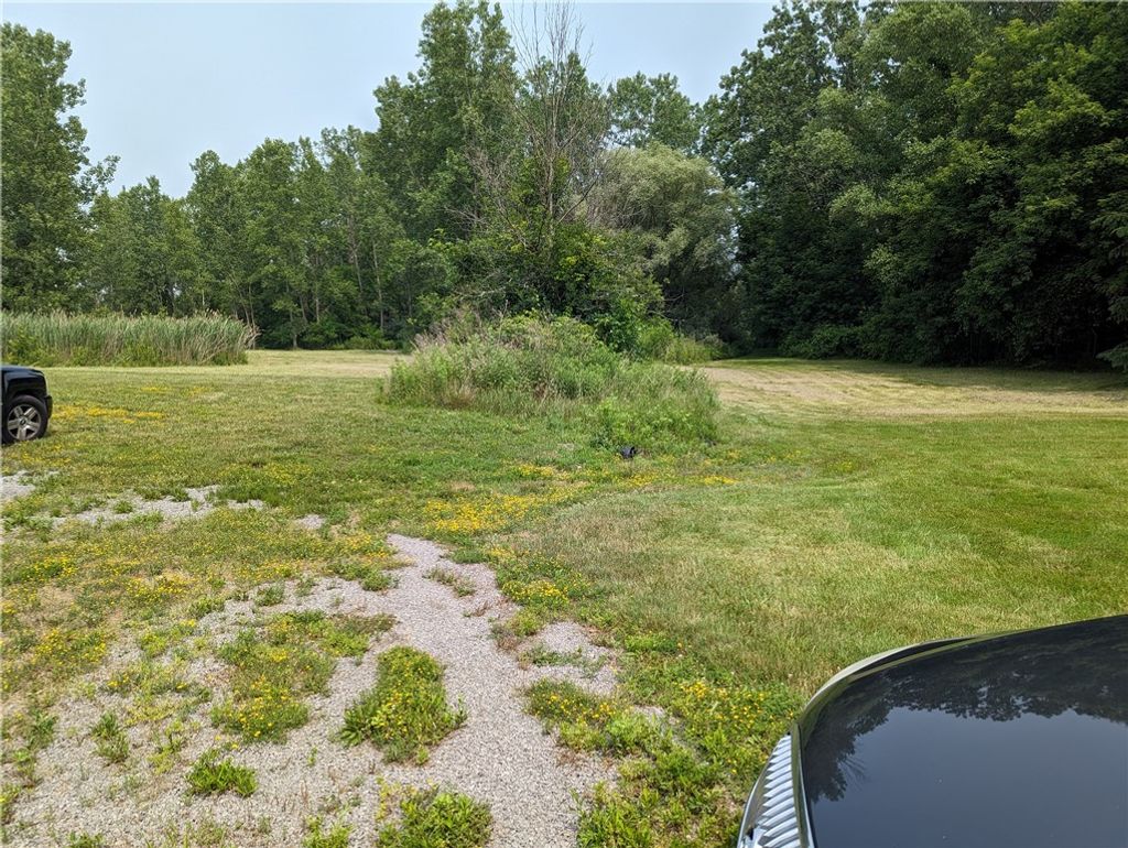 Photo of 1576 Ridge Road, Webster, NY 14580 (MLS # R1657427)