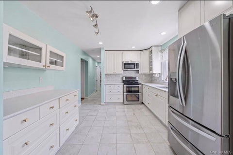 Photo of 18 Magic Mountain Drive, Coram, NY 11727 (MLS # 1062087)