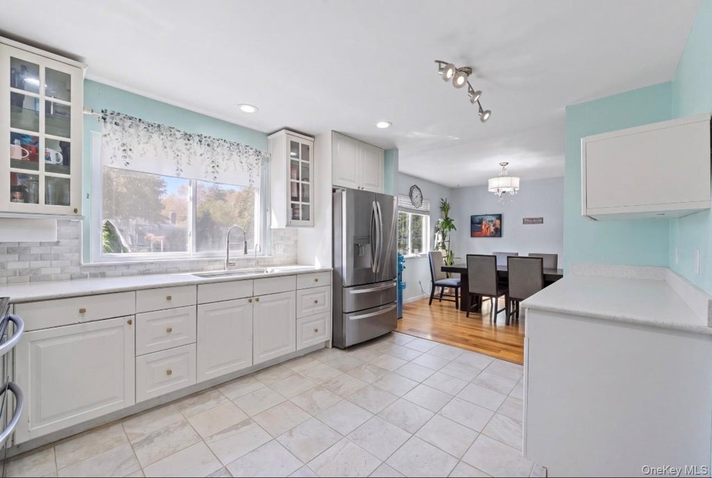 Photo of 18 Magic Mountain Drive, Coram, NY 11727 (MLS # 1062087)
