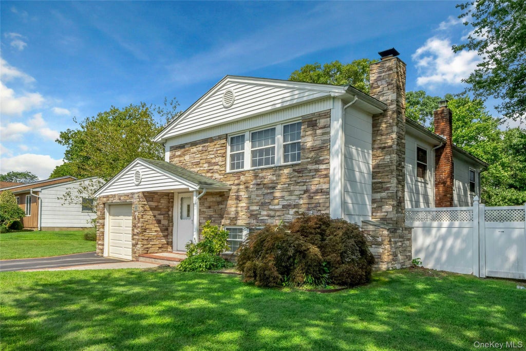 Photo of 15 Greenbrier Lane, Sayville, NY 11782 (MLS # 1024423)