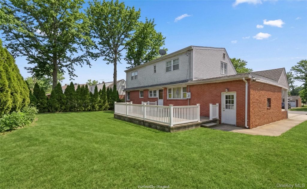 Photo of 119 Woodoak Drive, Westbury, NY 11590 (MLS # 977296)