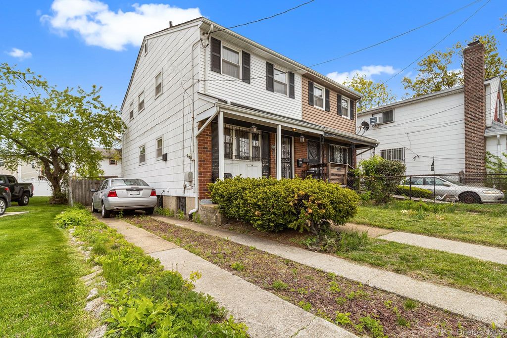 Photo of 12239 Long Street, Jamaica, NY 11434 (MLS # 998085)