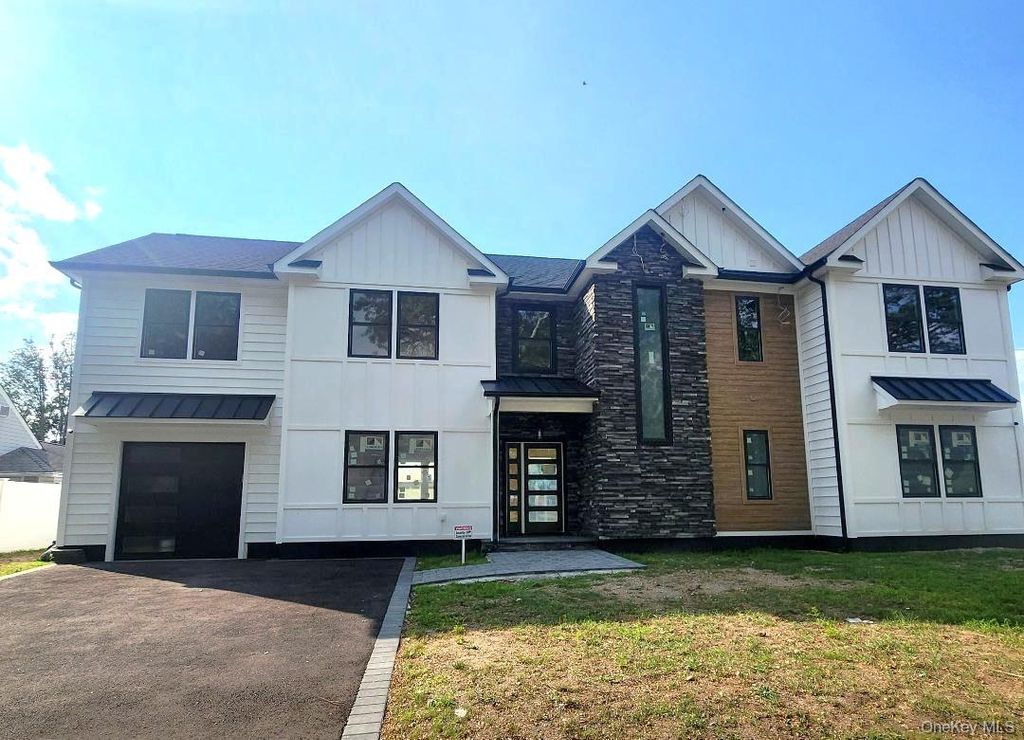 Photo of 2369 Stewart Avenue, Westbury, NY 11590 (MLS # 836927)