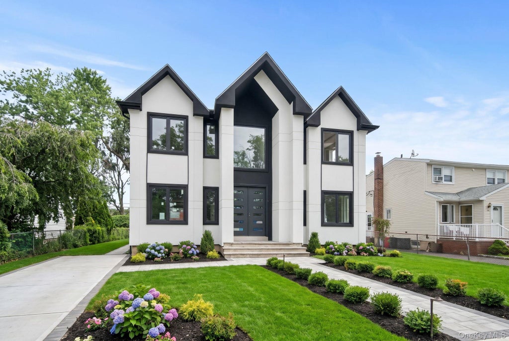 Photo of 748 Carman Avenue, Westbury, NY 11590 (MLS # 1020311)