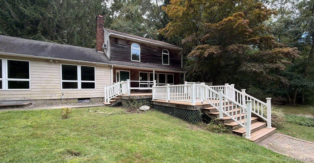 Photo of 56 E Bartlett Road, Middle Island, NY 11953 (MLS # 1057218)