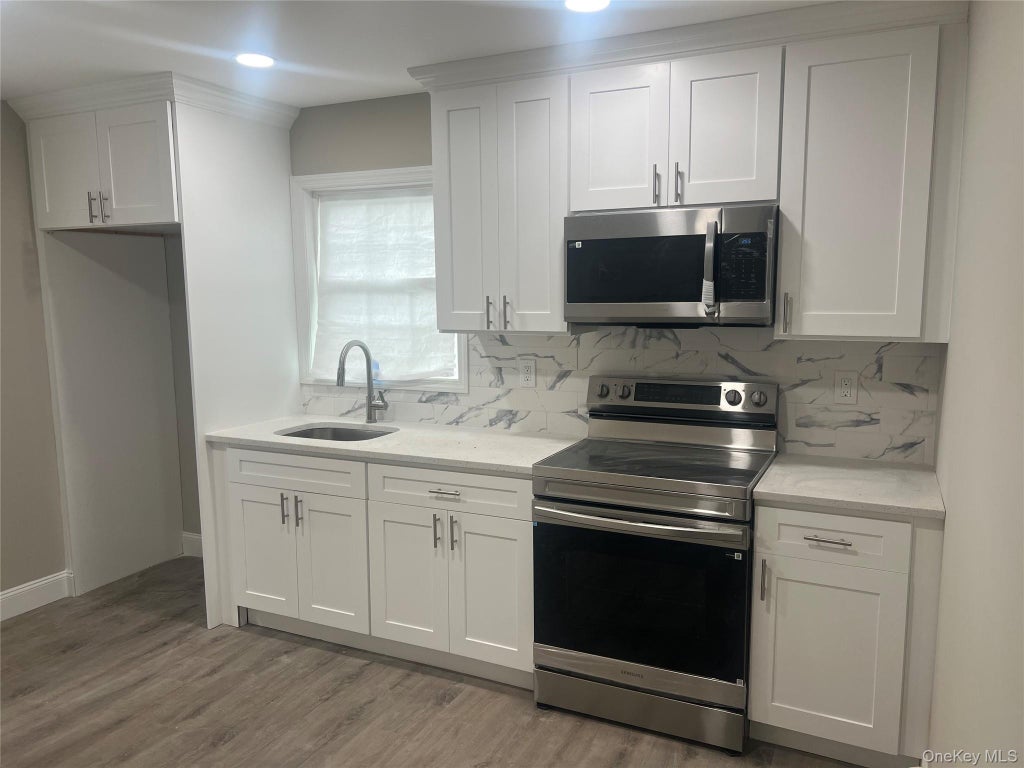 Photo of 6 E Booker Avenue, Wyandanch, NY 11798 (MLS # 1060045)