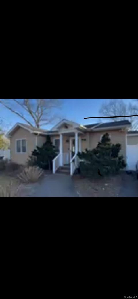 Photo of 24 Woodridge Road, Hampton Bays, NY 11946 (MLS # 968727)