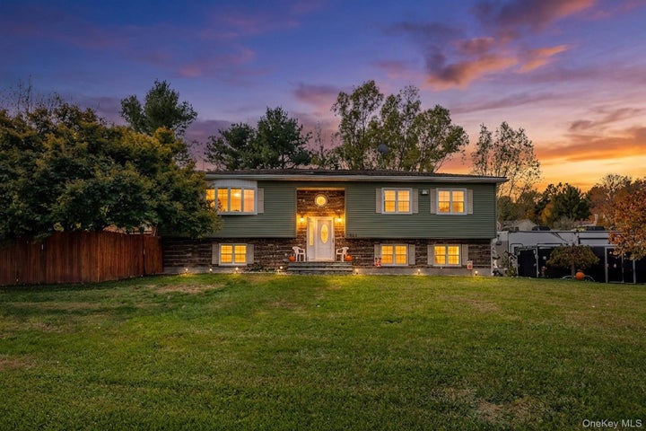 Split foyer home featuring brick siding