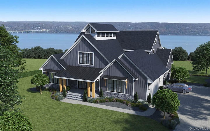 View of front of house featuring a standing seam roof, board and batten siding, a porch, and roof with shingles