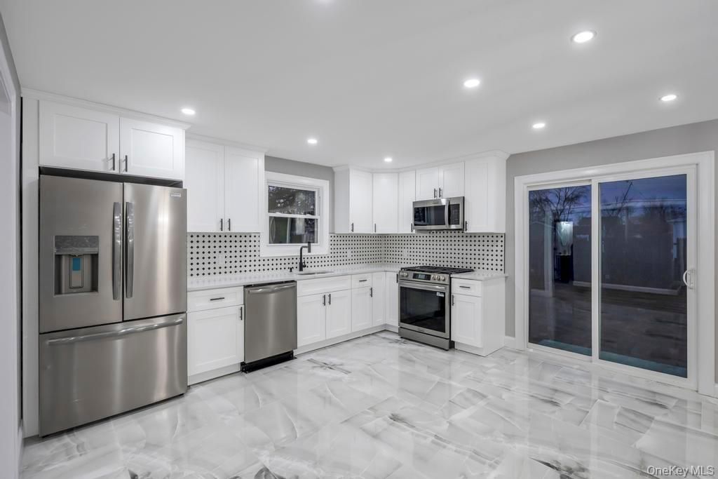 Photo of 27 Ash Street, Central Islip, NY 11722 (MLS # 952941)