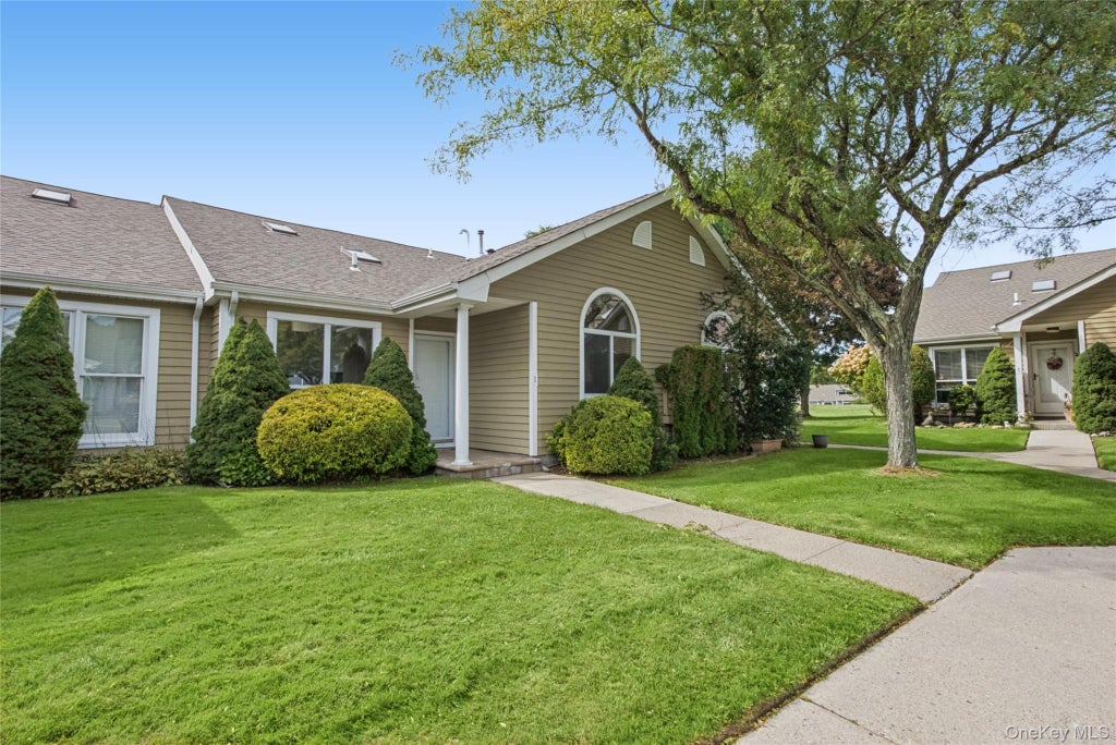 Photo of 65 Eric Drive, Middle Island, NY 11953 (MLS # 1055595)