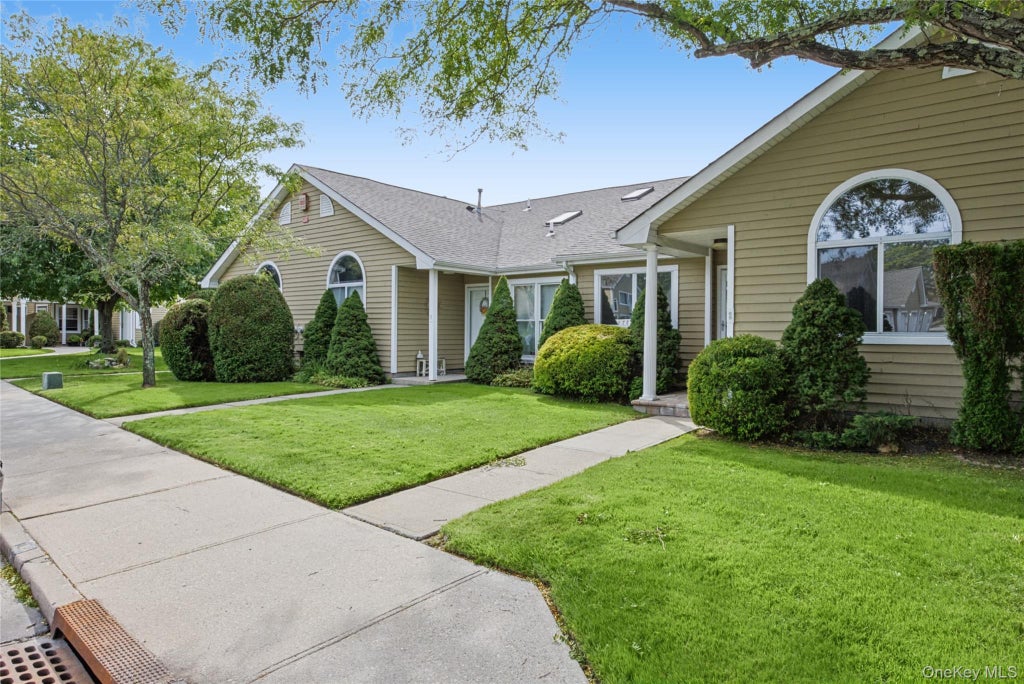 Photo of 65 Eric Drive, Middle Island, NY 11953 (MLS # 1055595)