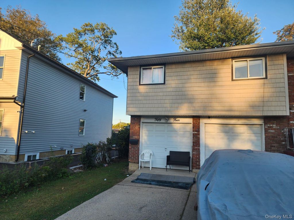 Photo of 54 Westfield Avenue, Roosevelt, NY 11575 (MLS # 922869)