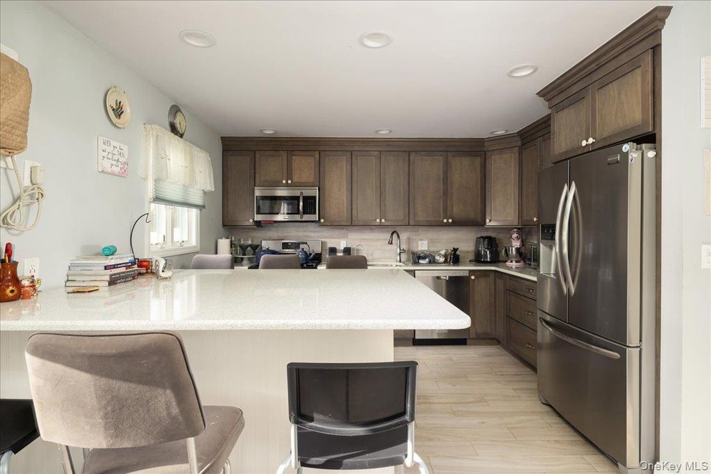 Photo of 61 Cedar Street, Massapequa, NY 11758 (MLS # 977222)