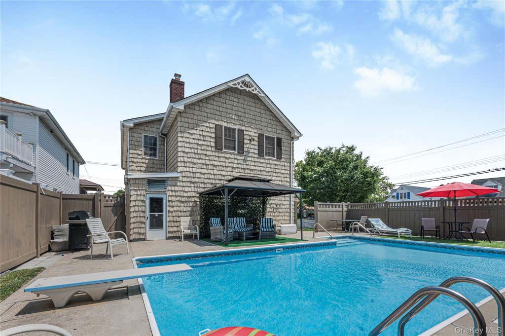 Photo of 87-17 157th Avenue, Howard Beach, NY 11414 (MLS # 1029234)