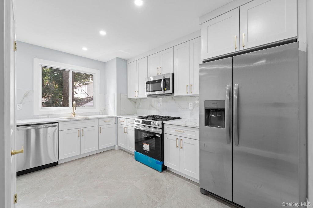 Photo of 10928 143rd Street, Jamaica, NY 11435 (MLS # 1054732)