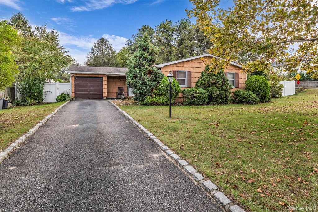 Photo of 100 Ridgewood Avenue, Holtsville, NY 11742 (MLS # 1064873)