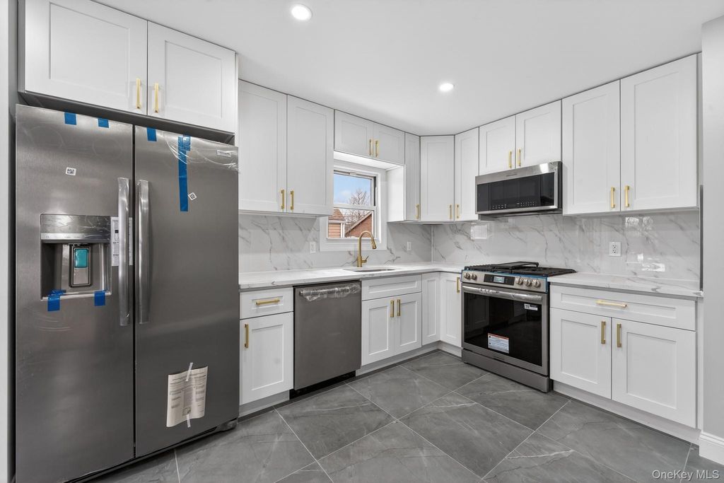 Photo of 9911 205th Place, Hollis, NY 11423 (MLS # 961030)