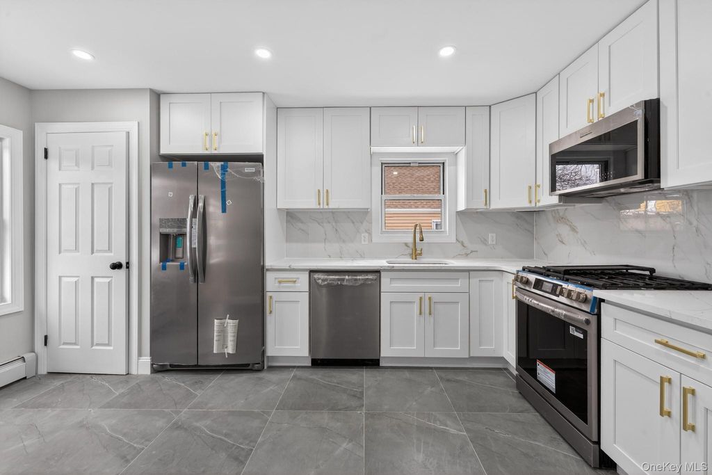 Photo of 9911 205th Place, Hollis, NY 11423 (MLS # 961030)