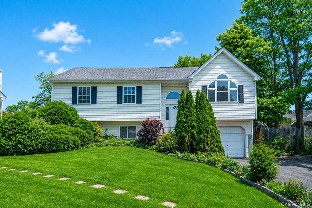 Photo of 57 Woodycrest Drive, Farmingville, NY 11738 (MLS # 1004026)