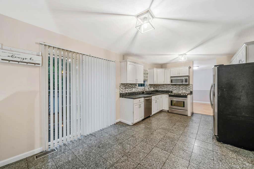Photo of 133 Cumberland Street, Mastic, NY 11950 (MLS # 1034766)