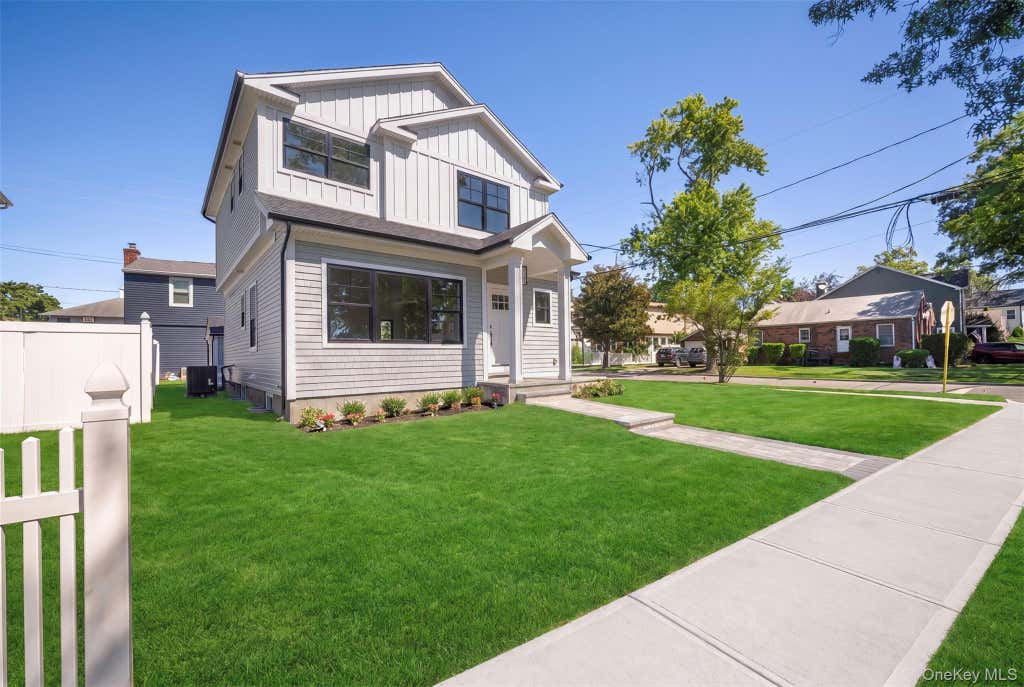 Photo of 97 Broadmoor Lane, Westbury, NY 11590 (MLS # 1042404)