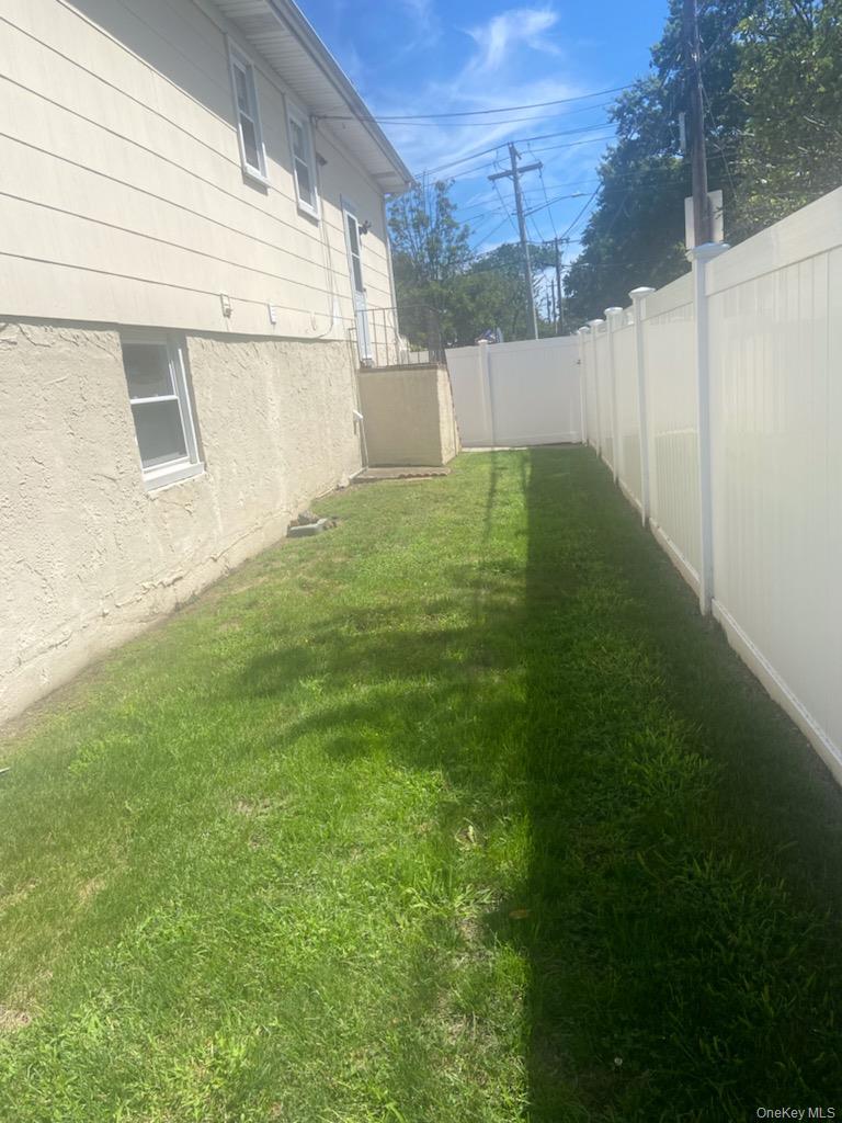 View of fenced backyard