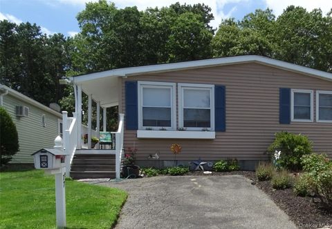 Photo of 77 Village Circle W Cir, Manorville, NY 11949 (MLS # 853523)